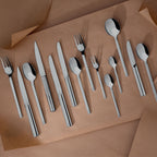 L'E STARCK MIRROR FINISH Cutlery set for 24 place settings solid handle serrated